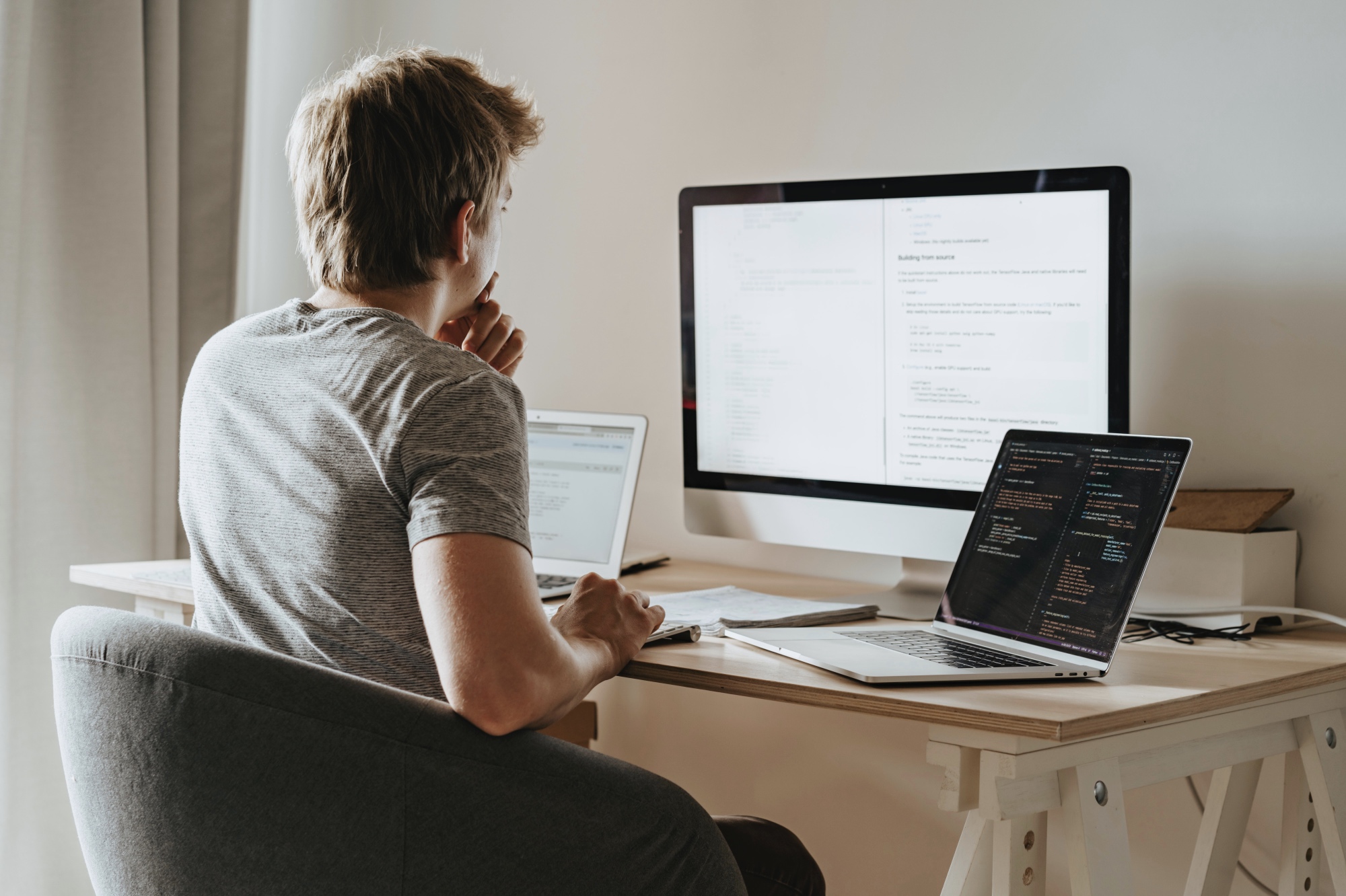 Studying code at a desk.